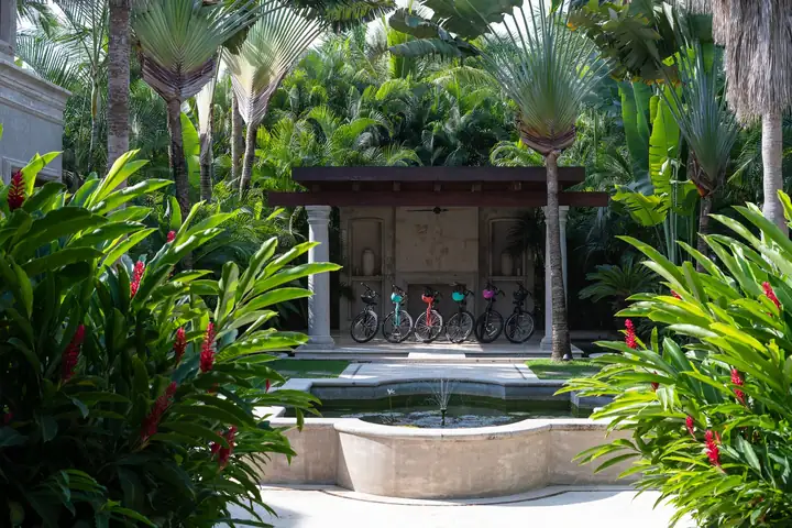 The garden fountain and the pavilion with the house bicycles