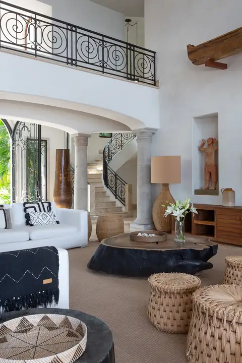 The living room and the staircase to the upper suites