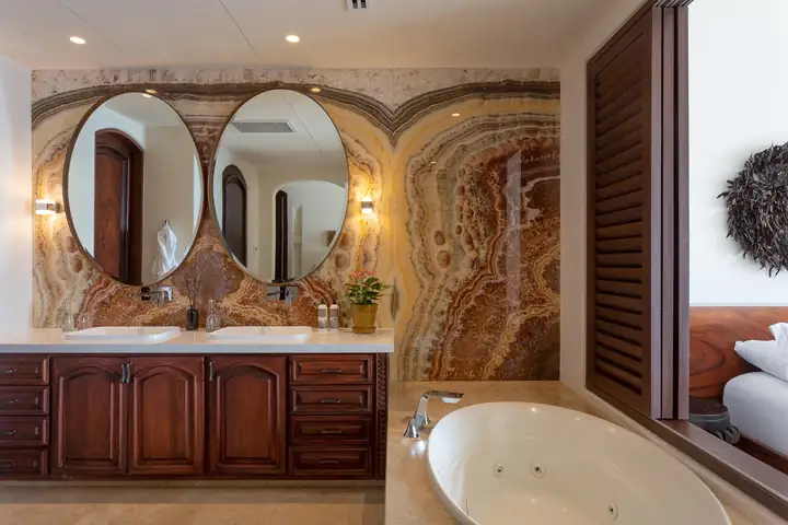 Ocean View Suite 3: the onyx-walled bathroom and tub